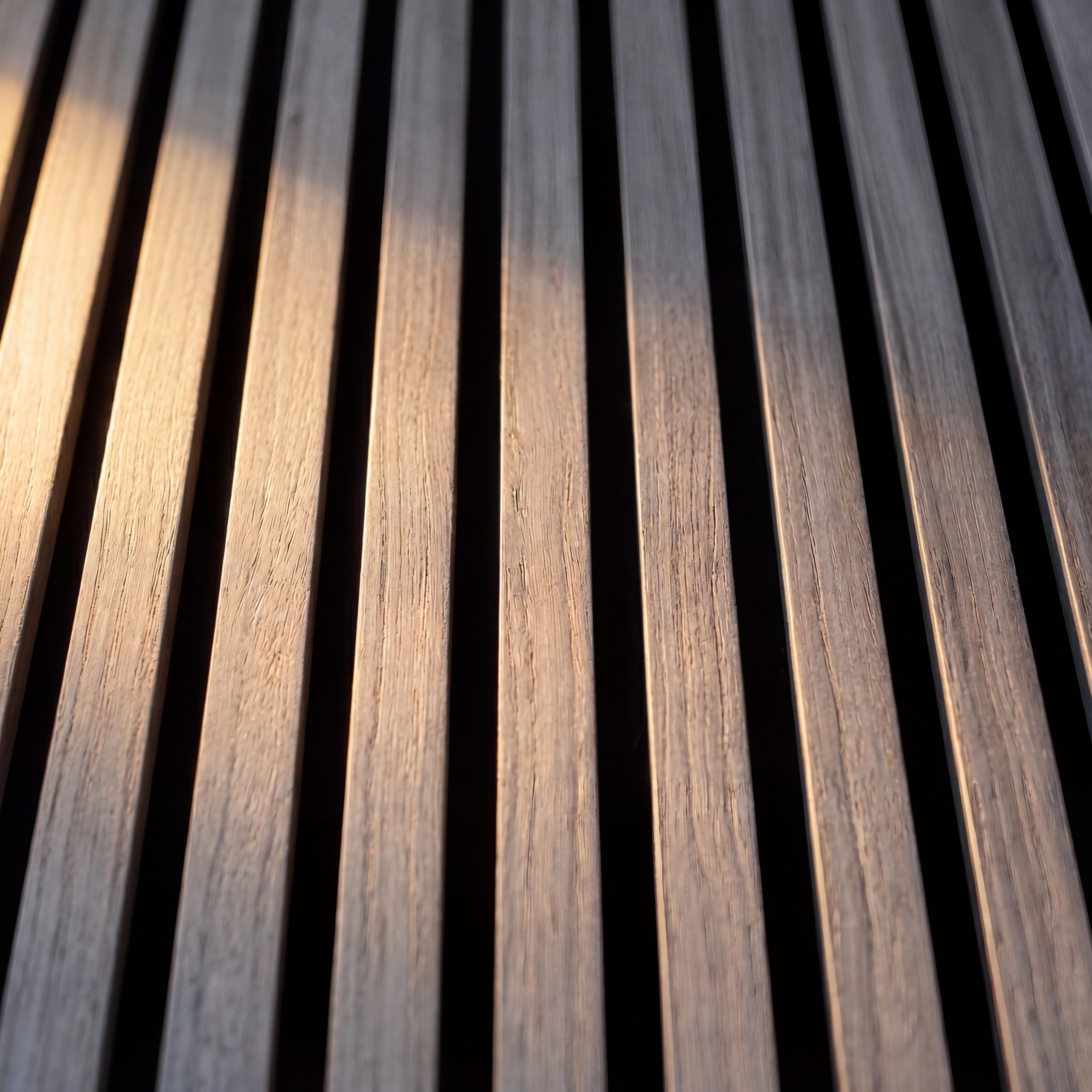 Close-up of 2.4m Alder Grey Wall Panel showing grey wood-effect slats, realistic grain detail and black acoustic felt backing.