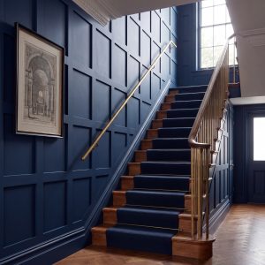Square MDF Wall Panel Kit installed on a staircase wall and painted navy blue for a bold decorative feature.